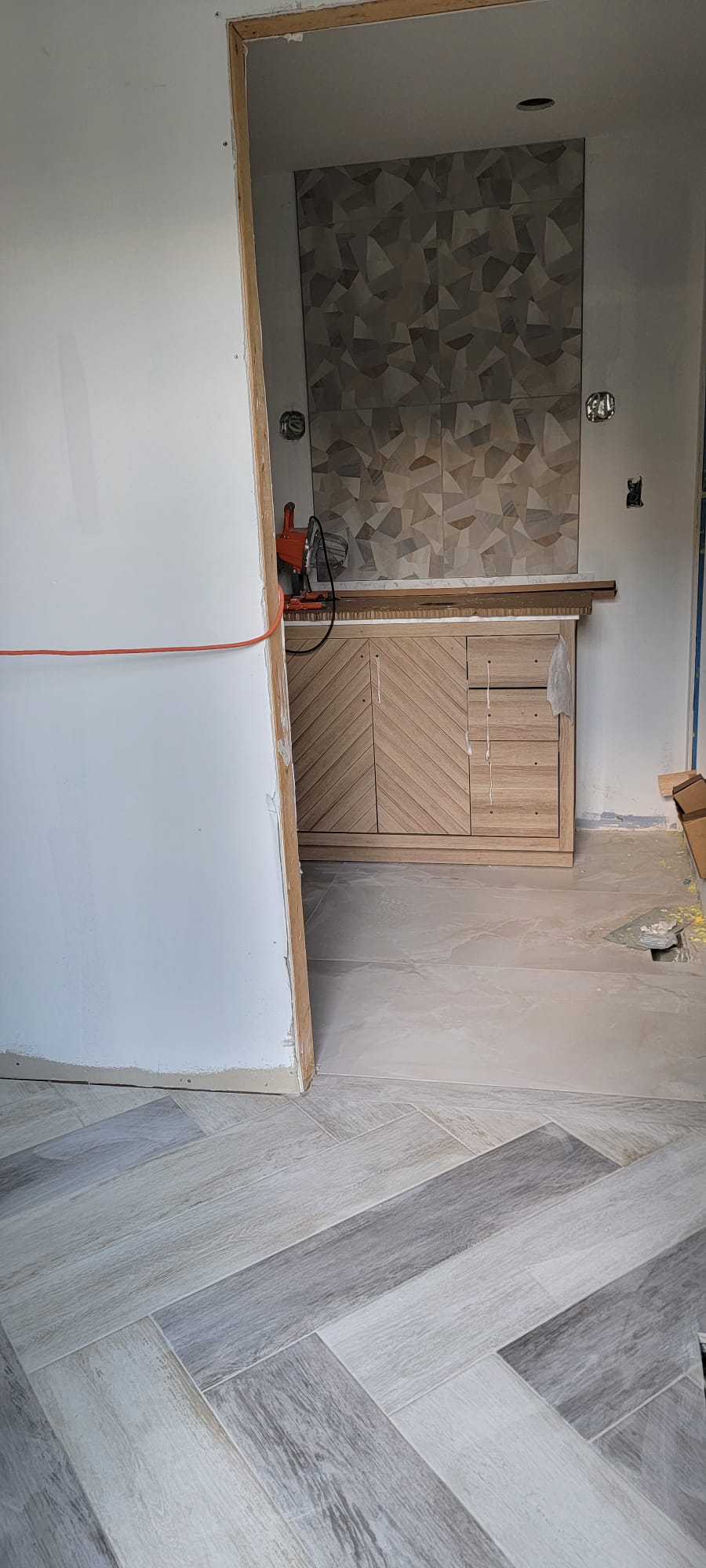 Wood-look tile in a herringbone pattern